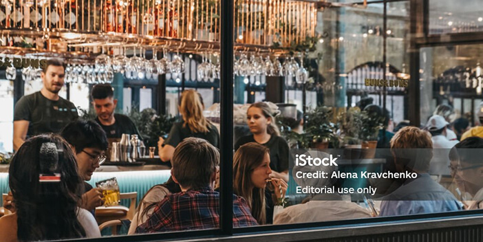 Bartenders in a crowded bar