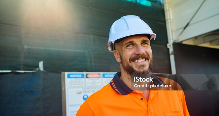 Photo of a construction worker, smiling