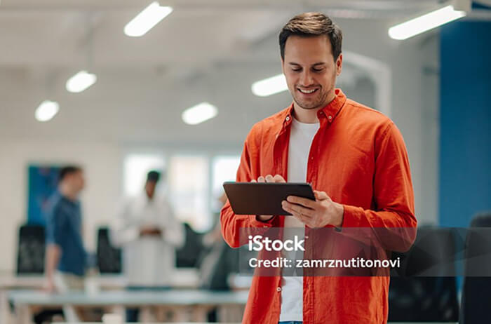 A man using a tablet device