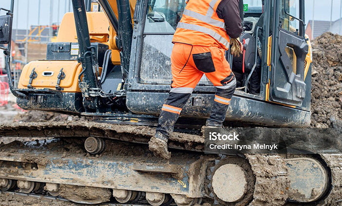 An outdoor construction worker wearing hi-vis